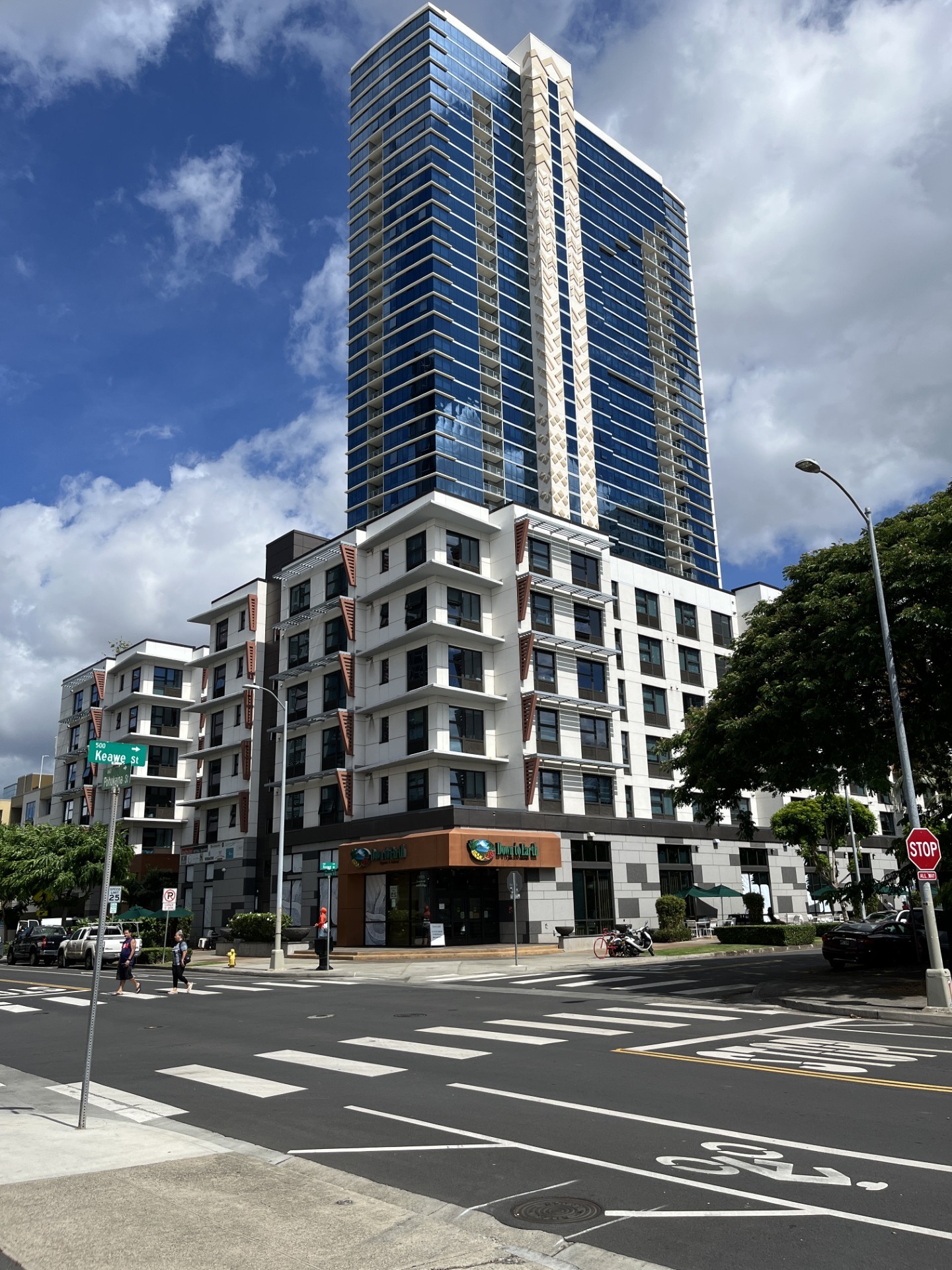 A tall building with a blue sky in the background.
