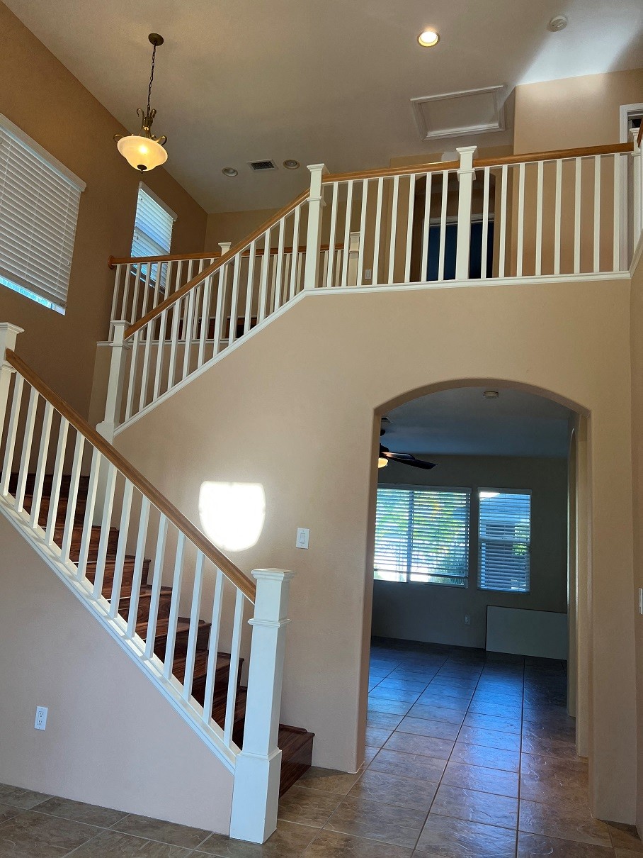 a view of a staircase in a house from the bottom of it