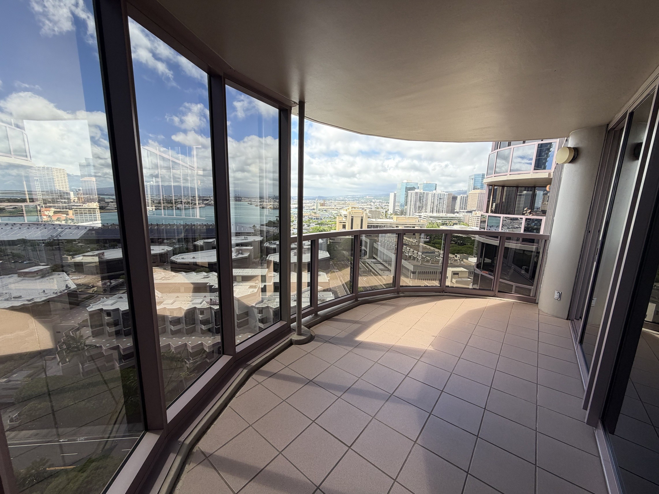 A balcony with a view of the cityscape.