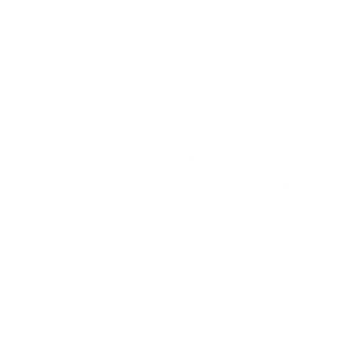 The image displays the text "3602 DUNN DRIVE" in white on a green background.