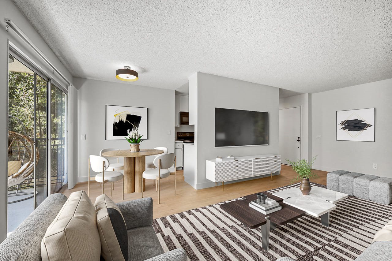 a living room with a couch and a table and a television