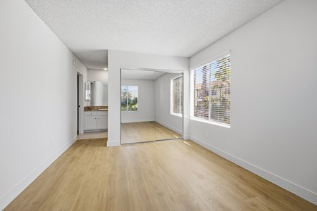 A room with wooden floors and white walls.