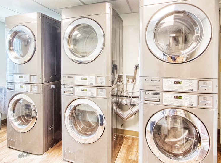 laundry room with stacked washers and dryers