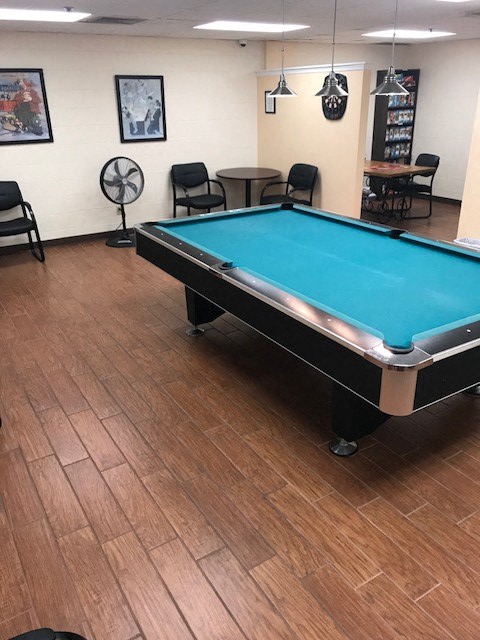game room with tables and chairs and pool table