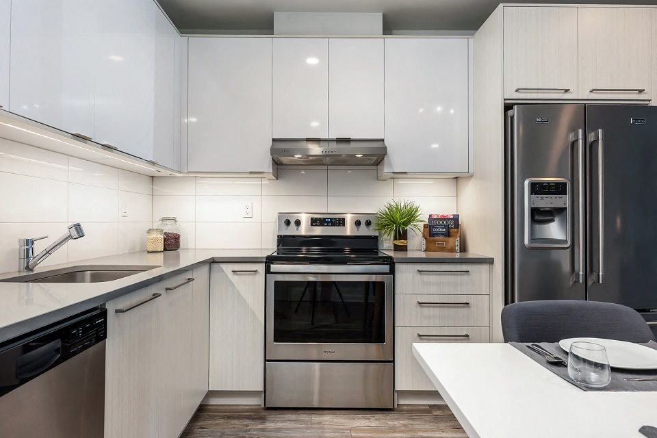 Kitchen with Stainless Steel Appliances at Le Saint-Laurent Apartments in Brossard