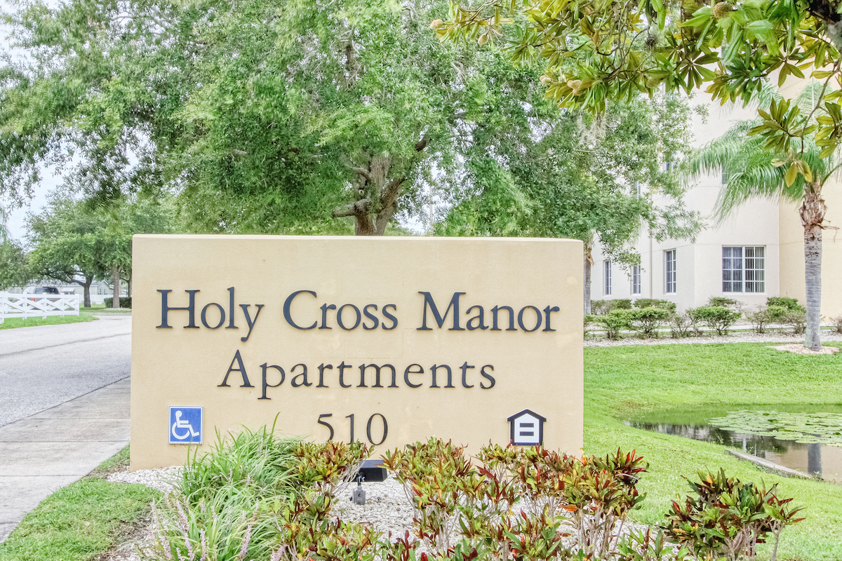 Monument sign at entrance to Holy Cross Manor I in Palmetto, FL
