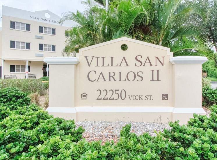 Signage in front of Villa San Carlos Senior Apartments in Port Charolette