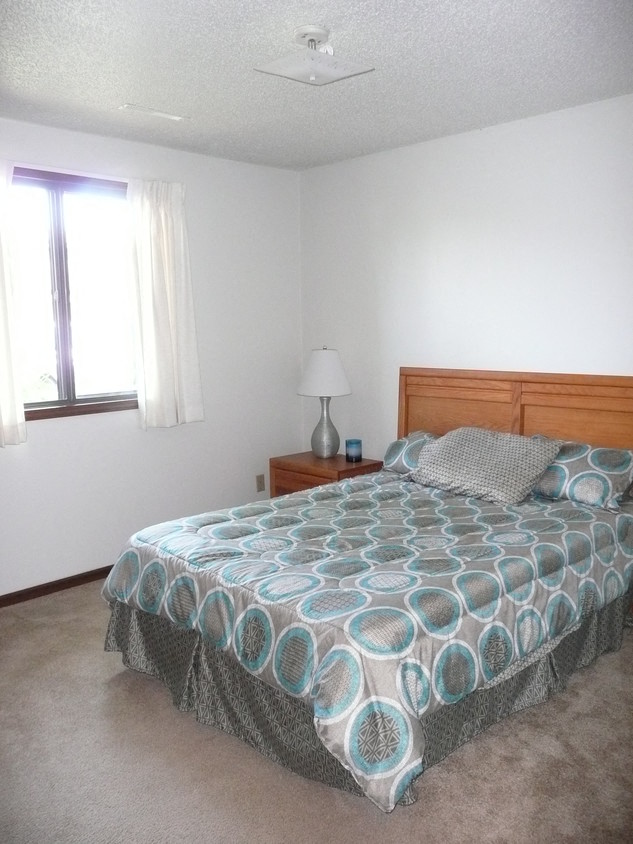 Beautiful Bright Bedroom With Wide Windows at Parkside Manor, Coralville, Iowa