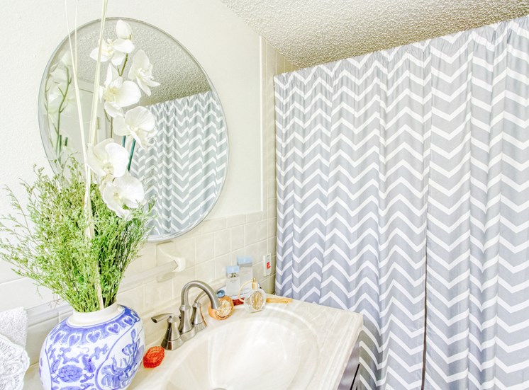 bathroom with decor and striped shower curtain