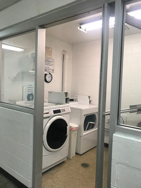 laundry center at The Oaks Apartments with washers and dryers