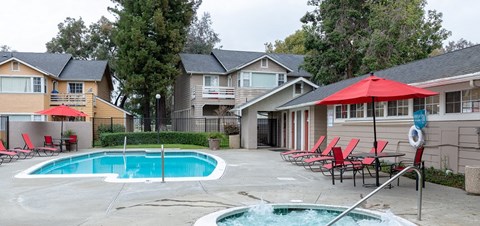 Pool with lounge chairs l Sundance Apartments in Vallejo CA