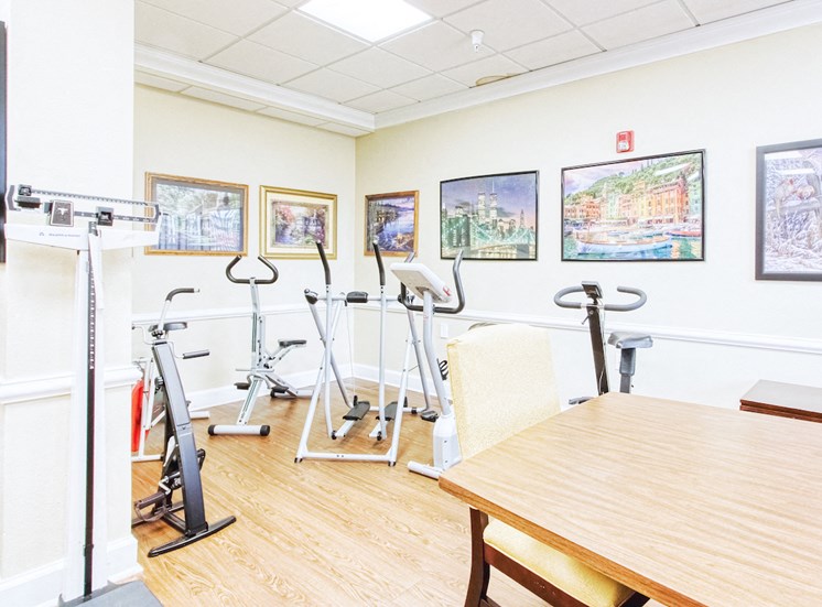 Exercise fitness center with cardio equipment and doctor's scale