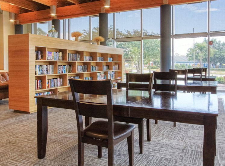 large book shelves with plenty of reading material and reading tables