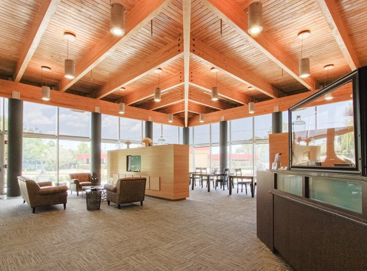 lobby with high ceiling, ceiling to floor windows, and seating