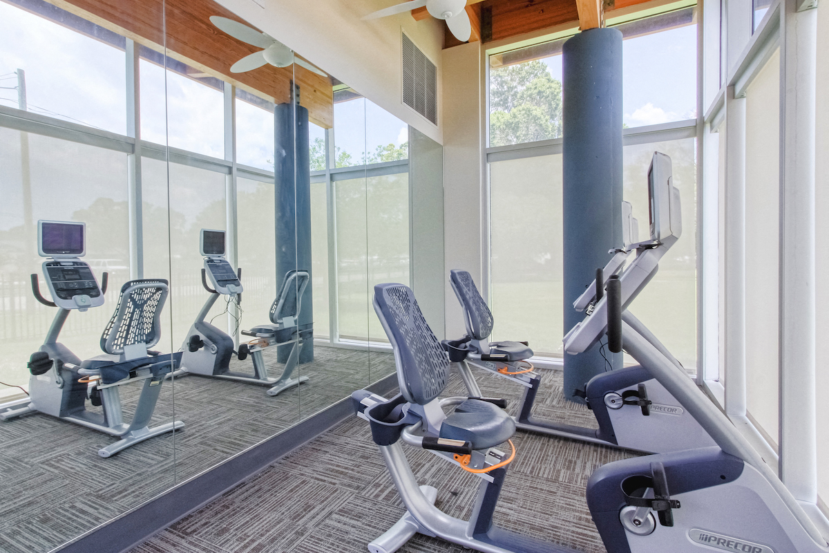 recumbent bikes in fitness center with mirrors