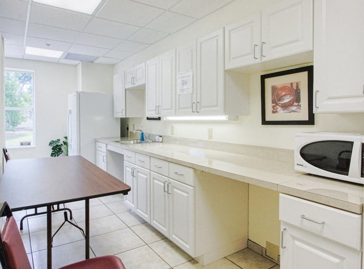 Community kitchen with microwave at St. Giles Manor