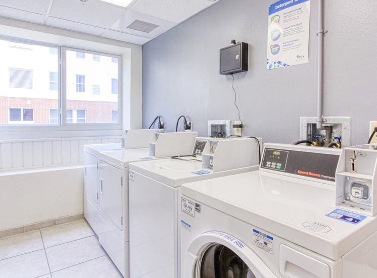 laundry center with washers and dryers