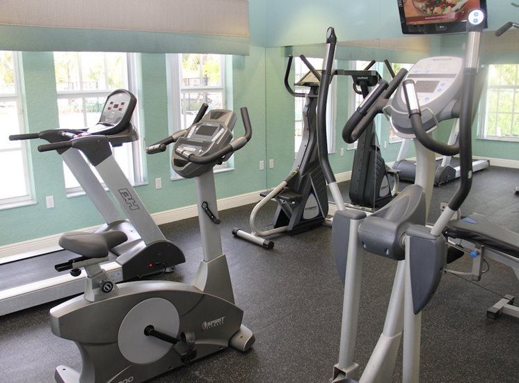 fitness center with bikes andtreadmills