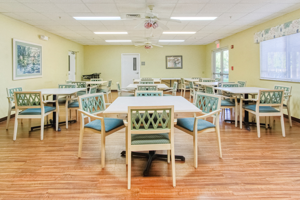 tables and chairs in community room set up for resident events