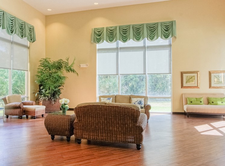 Lobby with large windows, natural light, and comfortable seating
