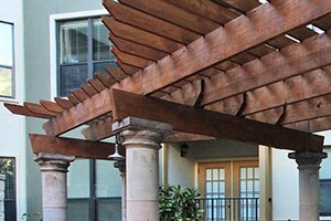 Heated spa under gazebo inside pool courtyard