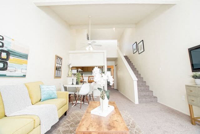 A living room with a loft at Chautauqua.
