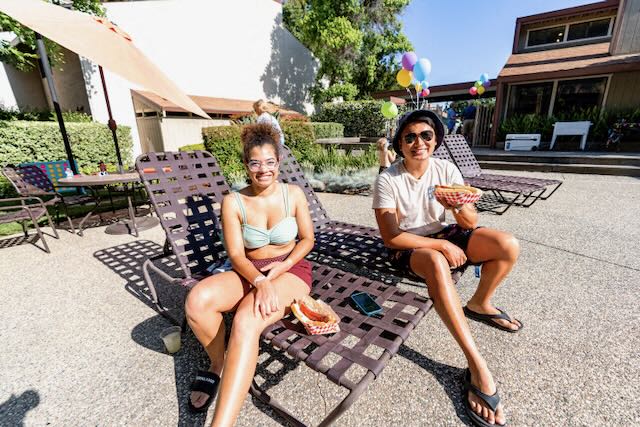 Residents sit near the pool at Chautauqua.