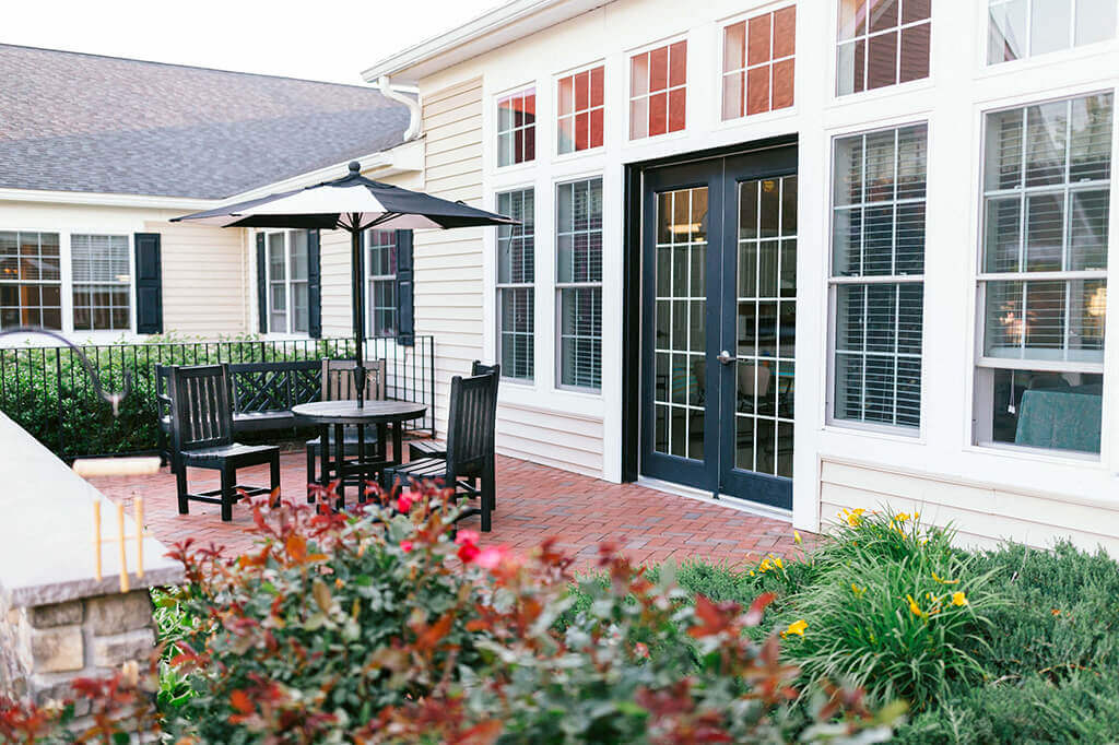 Patio with umbrella at Spring Arbor of Leesburg, Virginia, 20176-2062