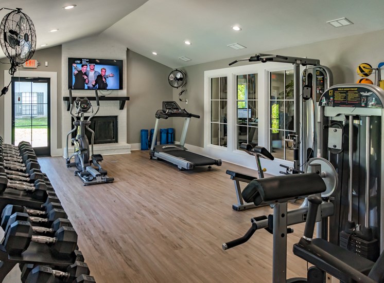 fitness center with cardio, strength, and stretching equipment