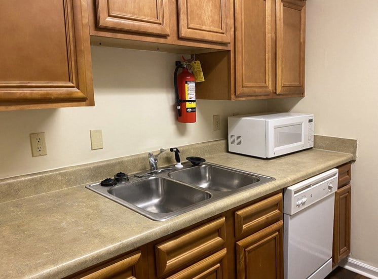 stainless steel sink and fire extinguisher in kitchen