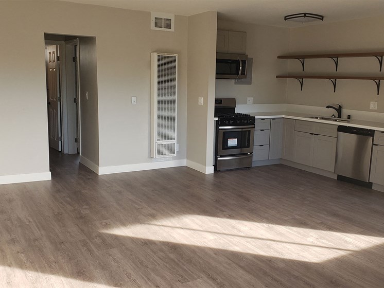 Living Room Space Near Kitchen and Dining Are at Wilson Apartments in Glendale, CA