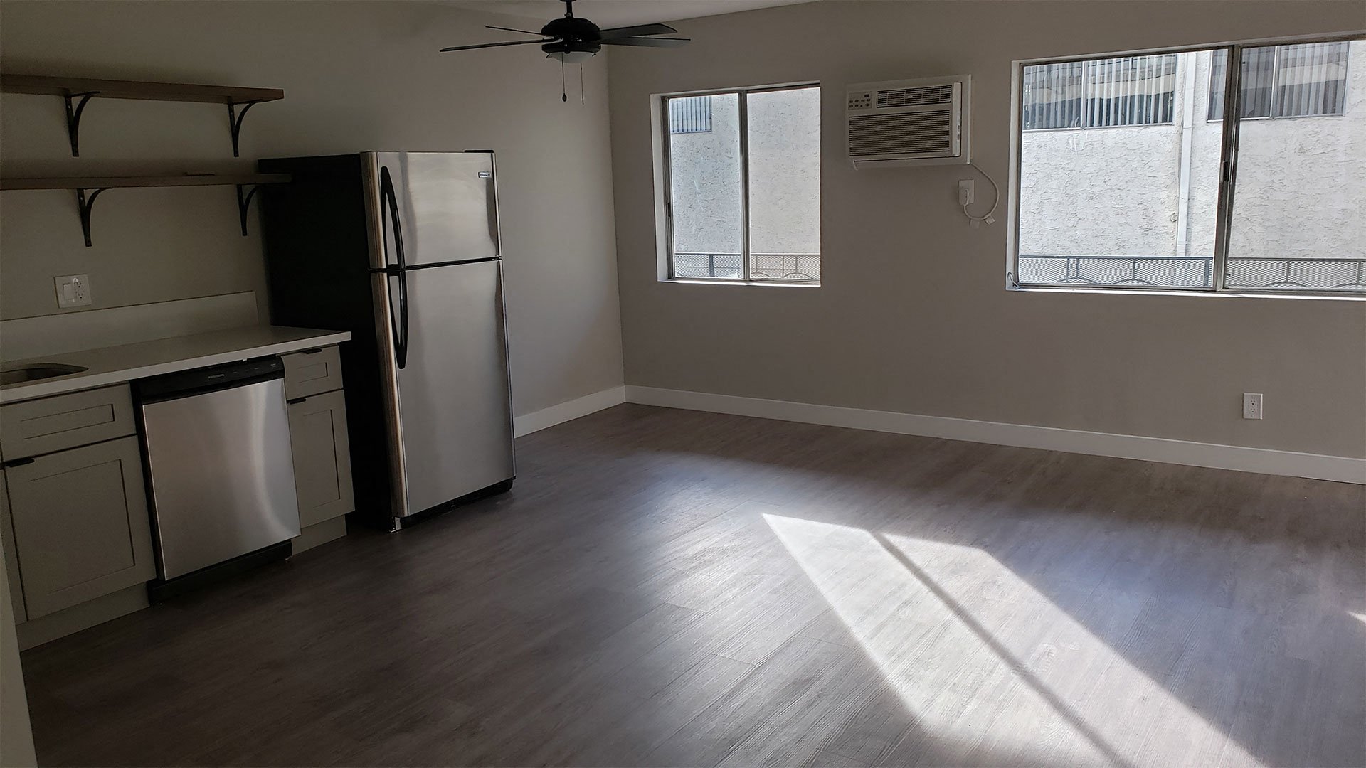 Kitchen Area With AC Unit, Hard-Wood Flooring, Plenty of Natural Light at Wilson Apartments in Glendale, CA