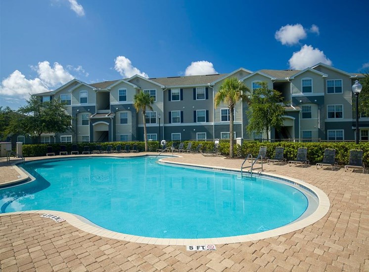 Swimming Pool With Lounge Seating at Camri Green Apartments, Jacksonville, FL