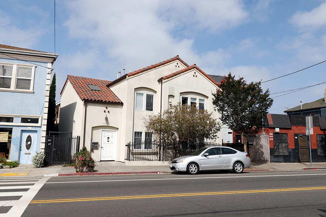 A picture of the building 6605 Shattuck with a silver car in front of the building.