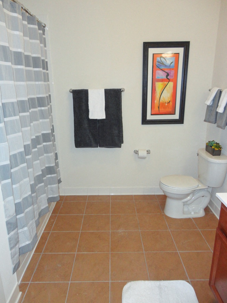 Tiled, spacious bathrooms