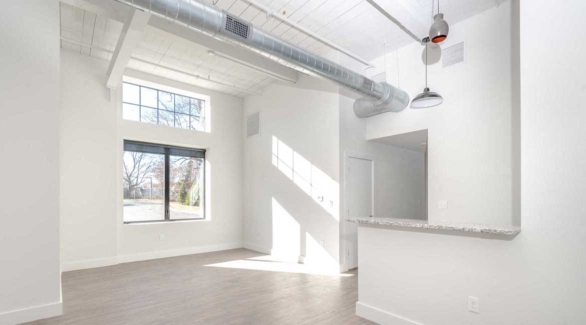 Open floor plan, high ceilings, oversized windows, exposed loft features.