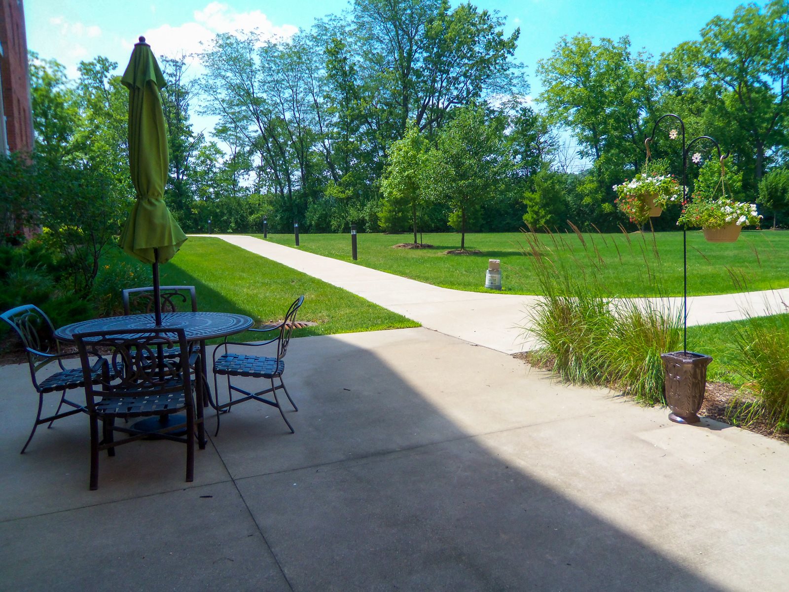 Large open grass area with seating