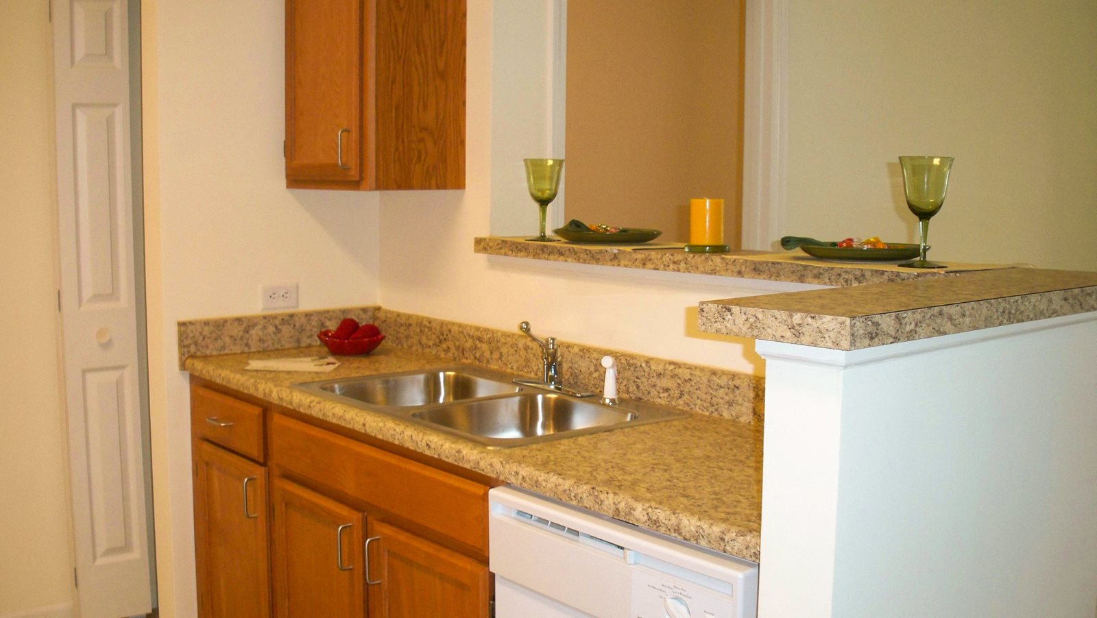 Kitchen, solid surface countertops, wooden cabinets, white appliances