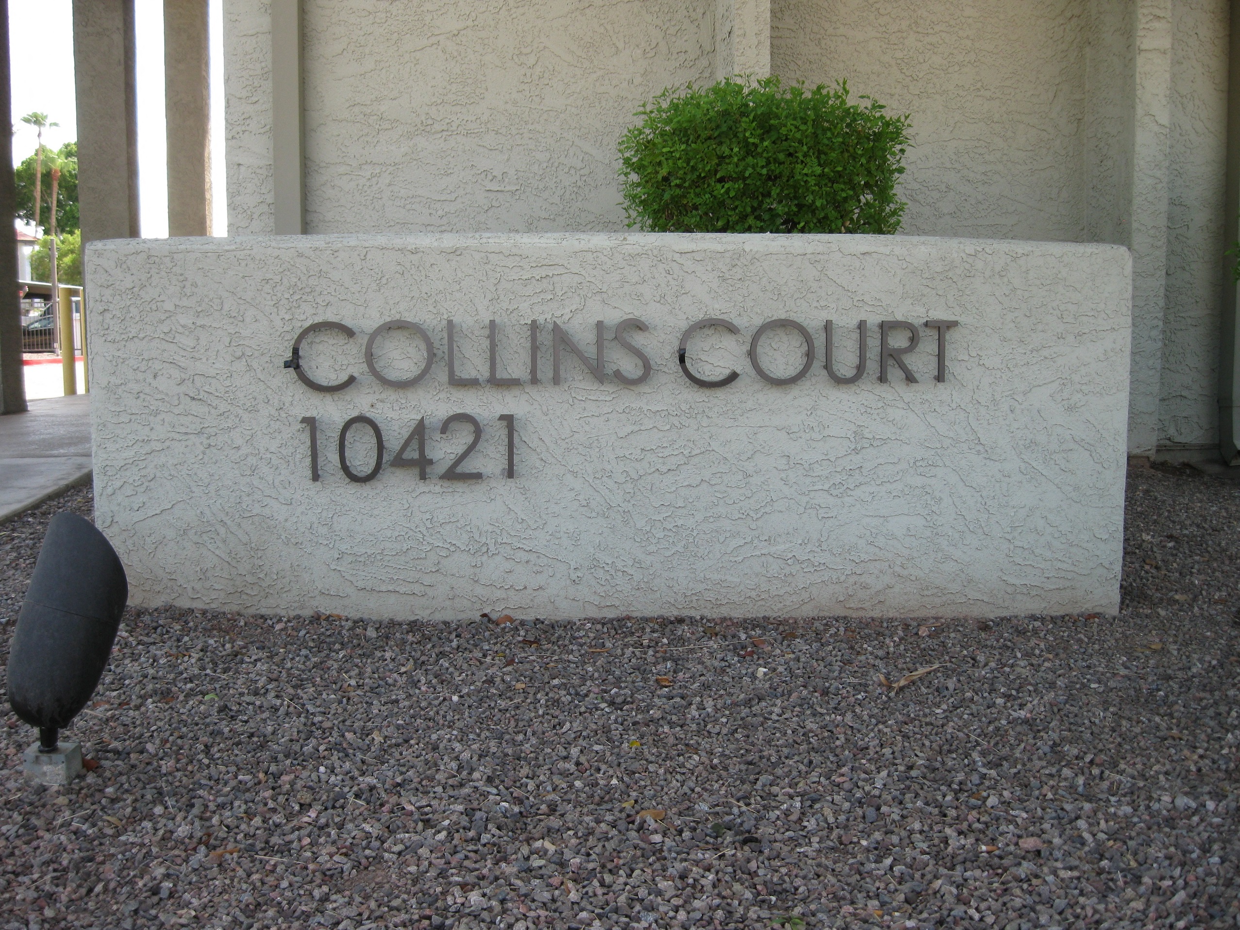 Apartment buildings and shared grounds at Collins Court