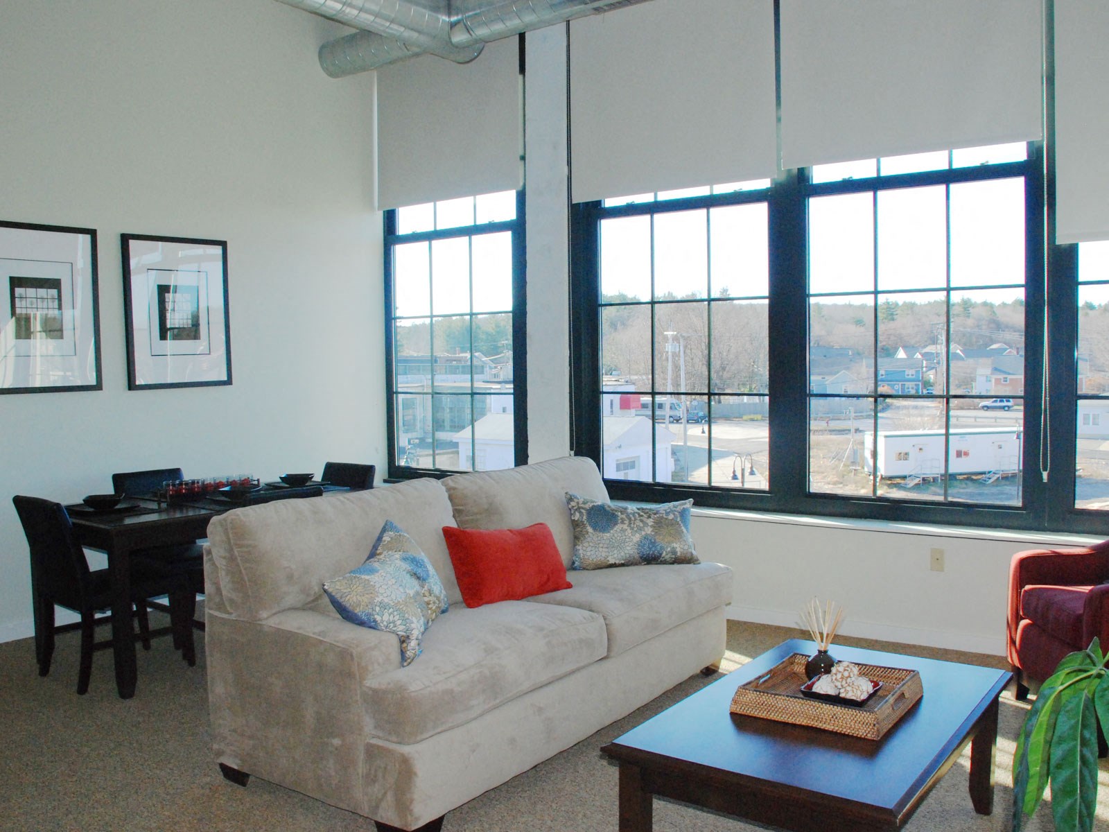 Furnished apartment interior featuring huge windows and lots of light