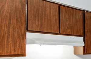Kitchen with white appliances and plenty of cabinetry for food and kitchen utensil storage