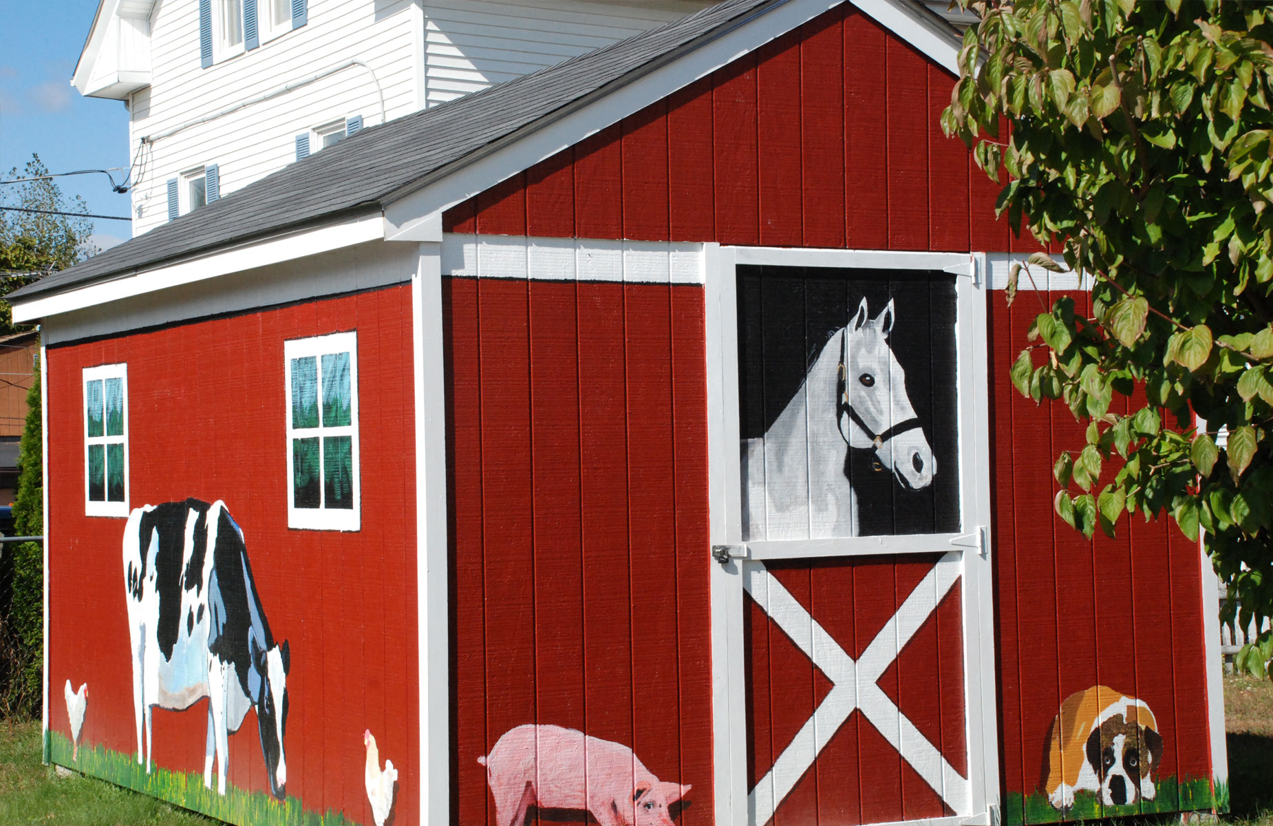 Tool shed space painted like a barn with animals