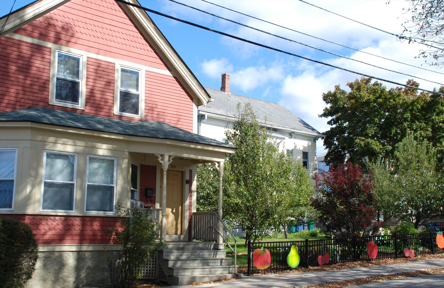 Home exterior image red clapboard with covered stoop.
