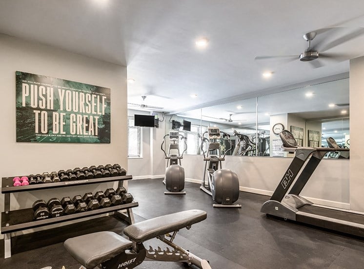 Fully equipped fitness center at The Georgian Apartments in New Orleans