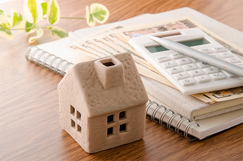 Papers and Calculator and House