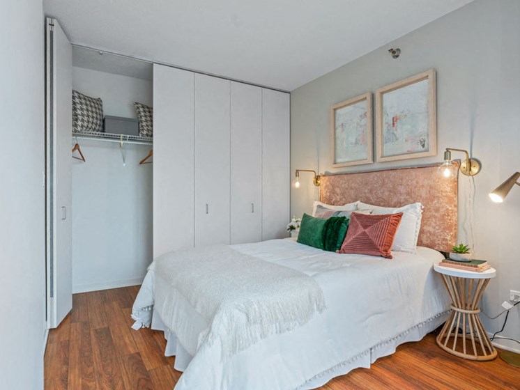 Bedroom with closet and Brazilian cherry wide plank floors at Kingsbury Plaza apartments at Kingsbury Plaza, Chicago, Illinois