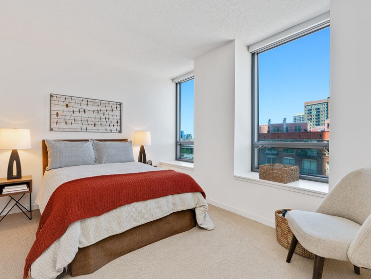 Kingsbury Plaza bedroom with large windows featuring views of River North Chicago