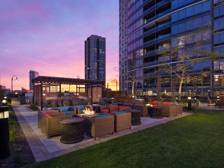 Outdoor fire pits, seating area, and gazebo at sunset at Kingsbury Plaza, Chicago, 60654