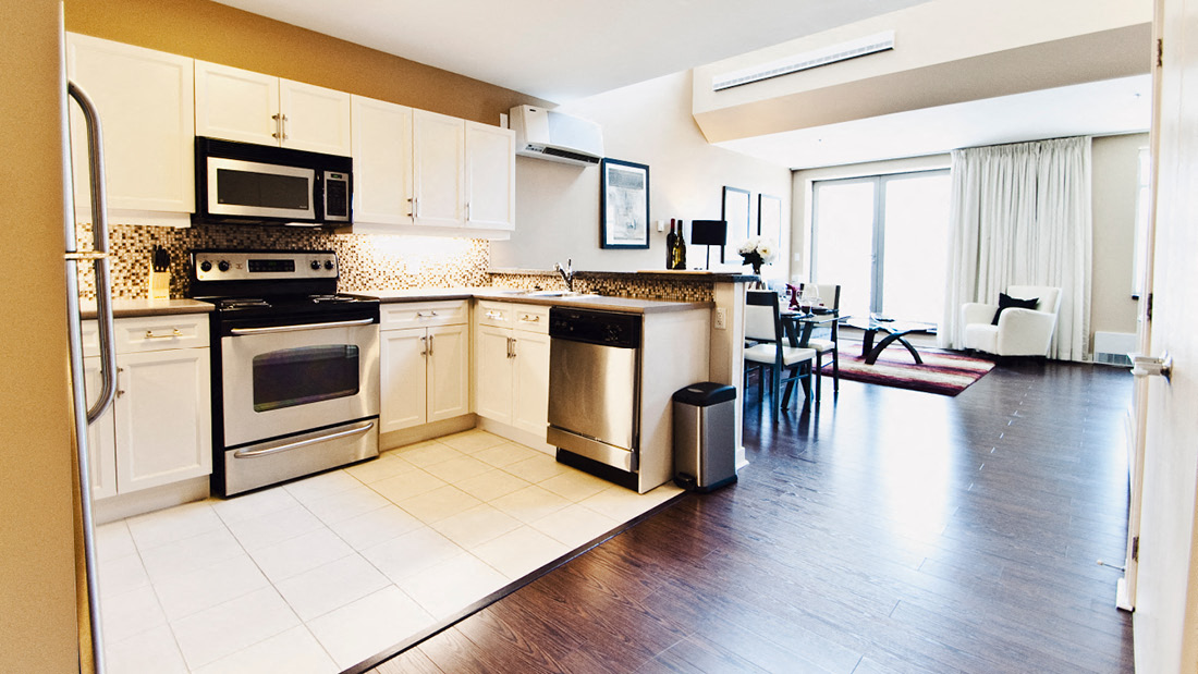 Kitchen With White Cabinets and Stainless Steel Appliances