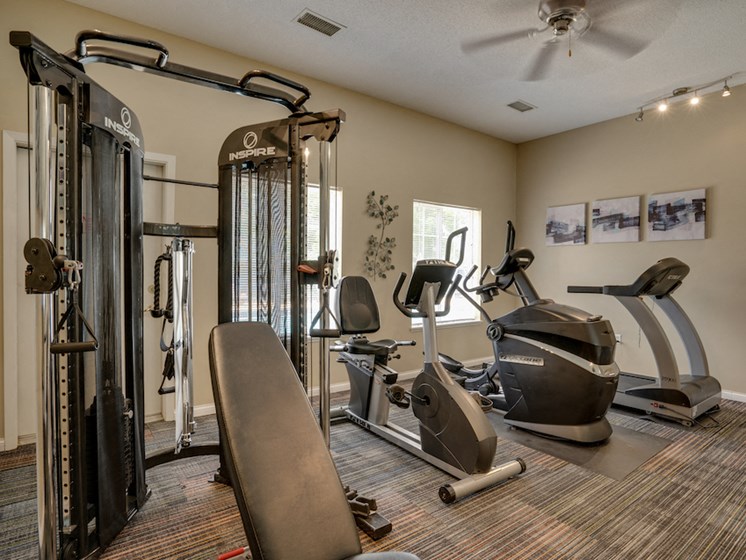 fitness room with various equipment